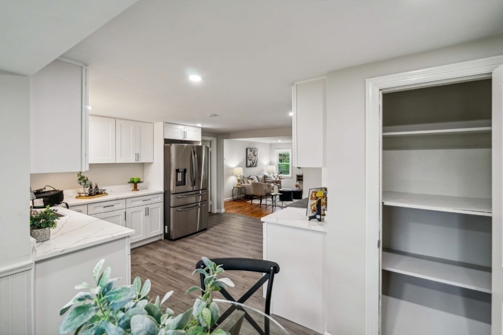 1 Arbor Road North Chelmsford, MA 01863 - Photo 12 of 40 a kitchen with a refrigerator and a stove top oven