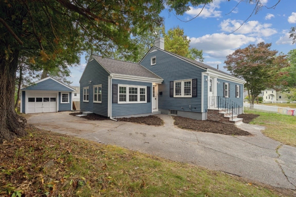 1 Arbor Road North Chelmsford, MA 01863 - Photo 37 of 40 a front view of a house with a garden
