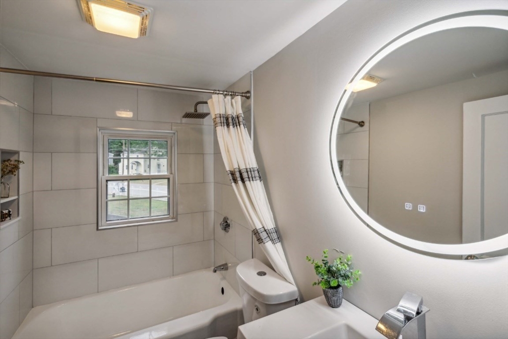 1 Arbor Road North Chelmsford, MA 01863 - Photo 6 of 40 a bathroom with a sink and a mirror
