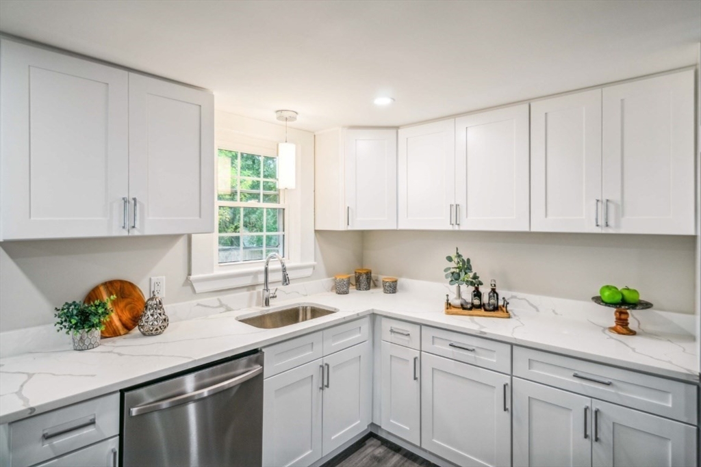 1 Arbor Road North Chelmsford, MA 01863 - Photo 9 of 40 a kitchen with white cabinets white appliances and a sink