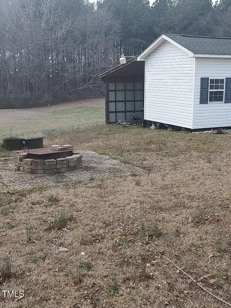 2960 Federal Road Benson, NC 27504 - Photo 17 of 45 There is a concrete pad, that could be another hang out space with a fire pit!~
