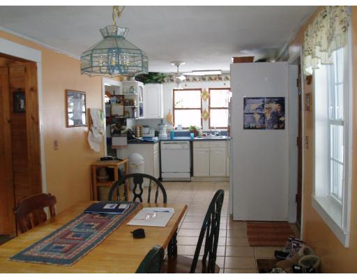 64 Searle Road Huntington, MA 01050 - Photo 11 of 13 a room with furniture and a chandelier