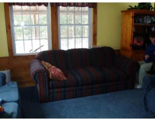 64 Searle Road Huntington, MA 01050 - Photo 12 of 13 a living room with furniture and a window