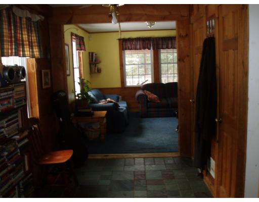 64 Searle Road Huntington, MA 01050 - Photo 13 of 13 a living room with furniture and a window