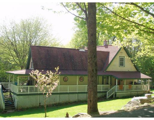 64 Searle Road Huntington, MA 01050 - Photo 8 of 13 front view of a house with a yard