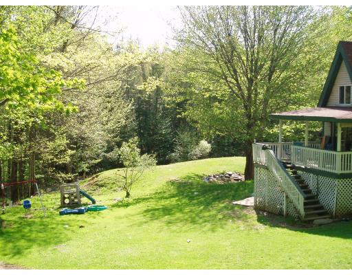 64 Searle Road Huntington, MA 01050 - Photo 9 of 13 a view of a garden with a slide