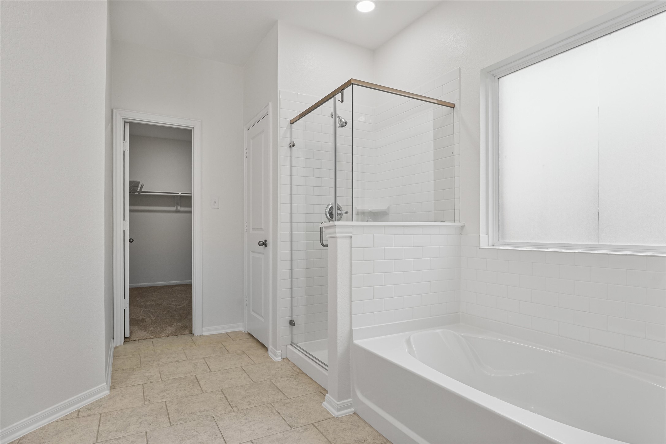 10511 Kings River Drive Rosharon, TX 77583 - Photo 13 of 25 a bathroom with a bathtub and a shower