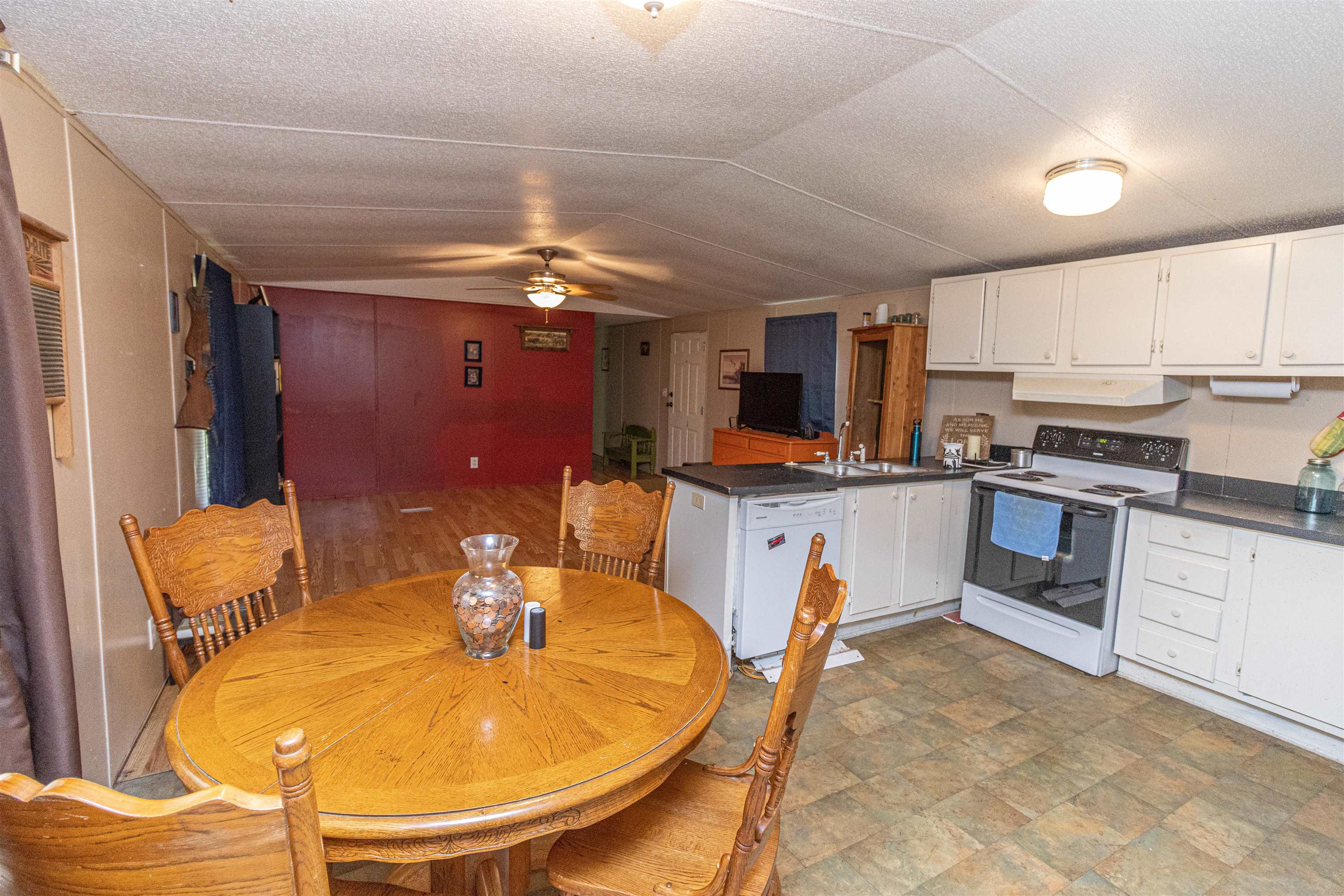 2550 Nichols Road Guys, TN 38339 - Photo 4 of 19 a kitchen with a refrigerator and a dining table