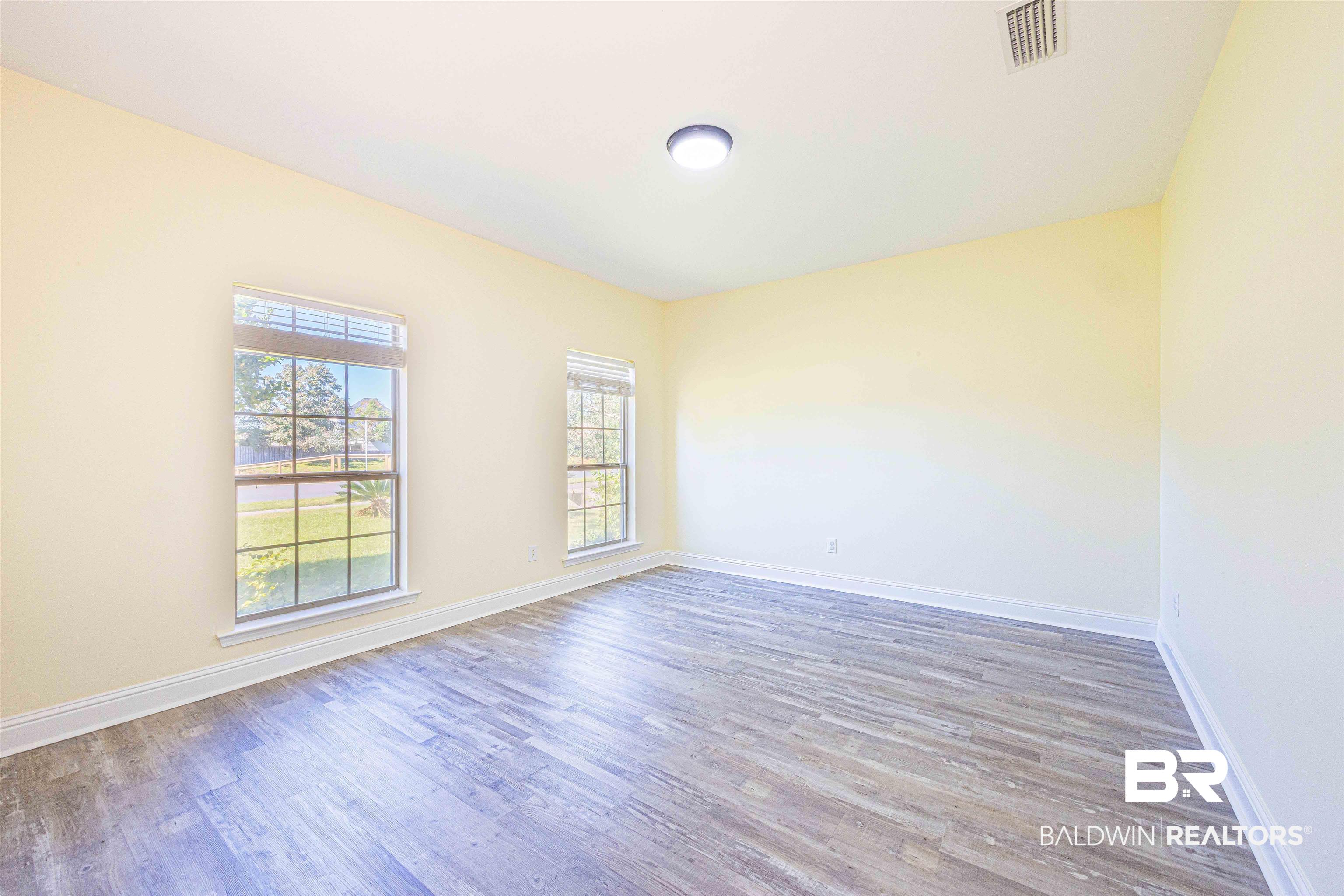 25234 Fairfax Road Daphne, AL 36526 - Photo 29 of 45 Unfurnished room with light wood-style flooring and baseboards