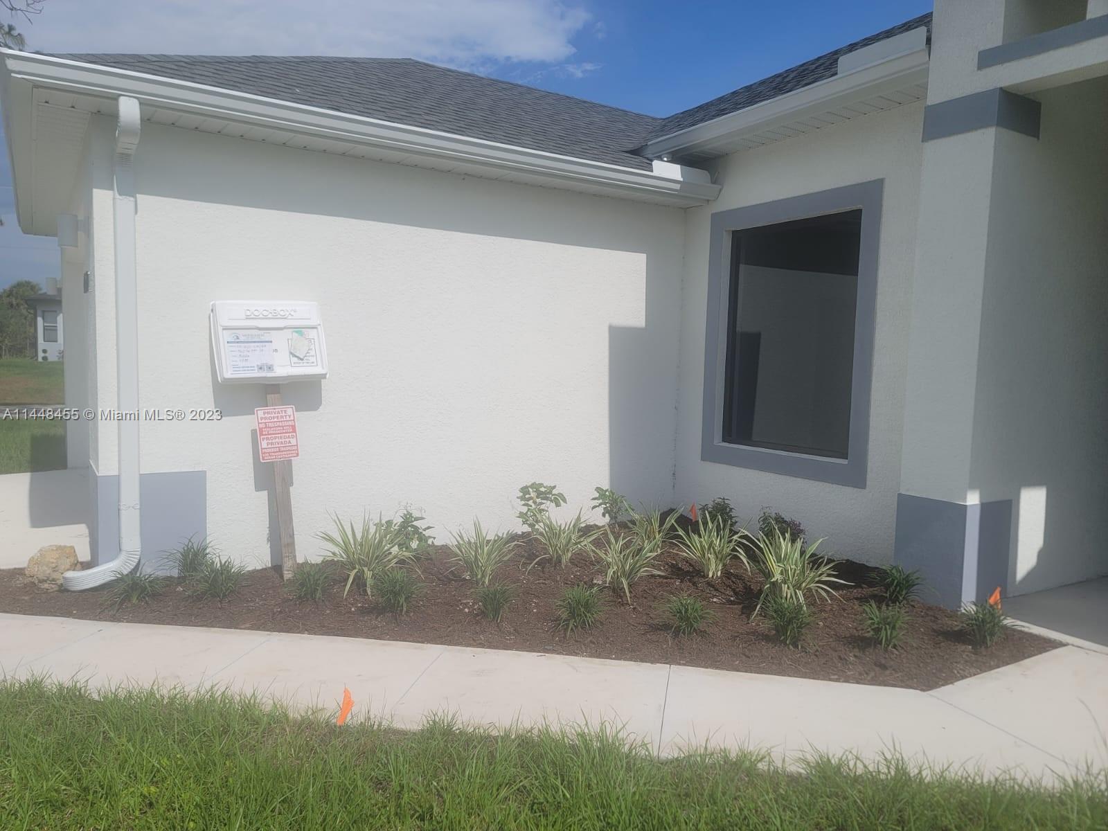 401 West 5th Street, Unit ST Lehigh Acres, FL 33972 - Photo 4 of 10 a front view of a house