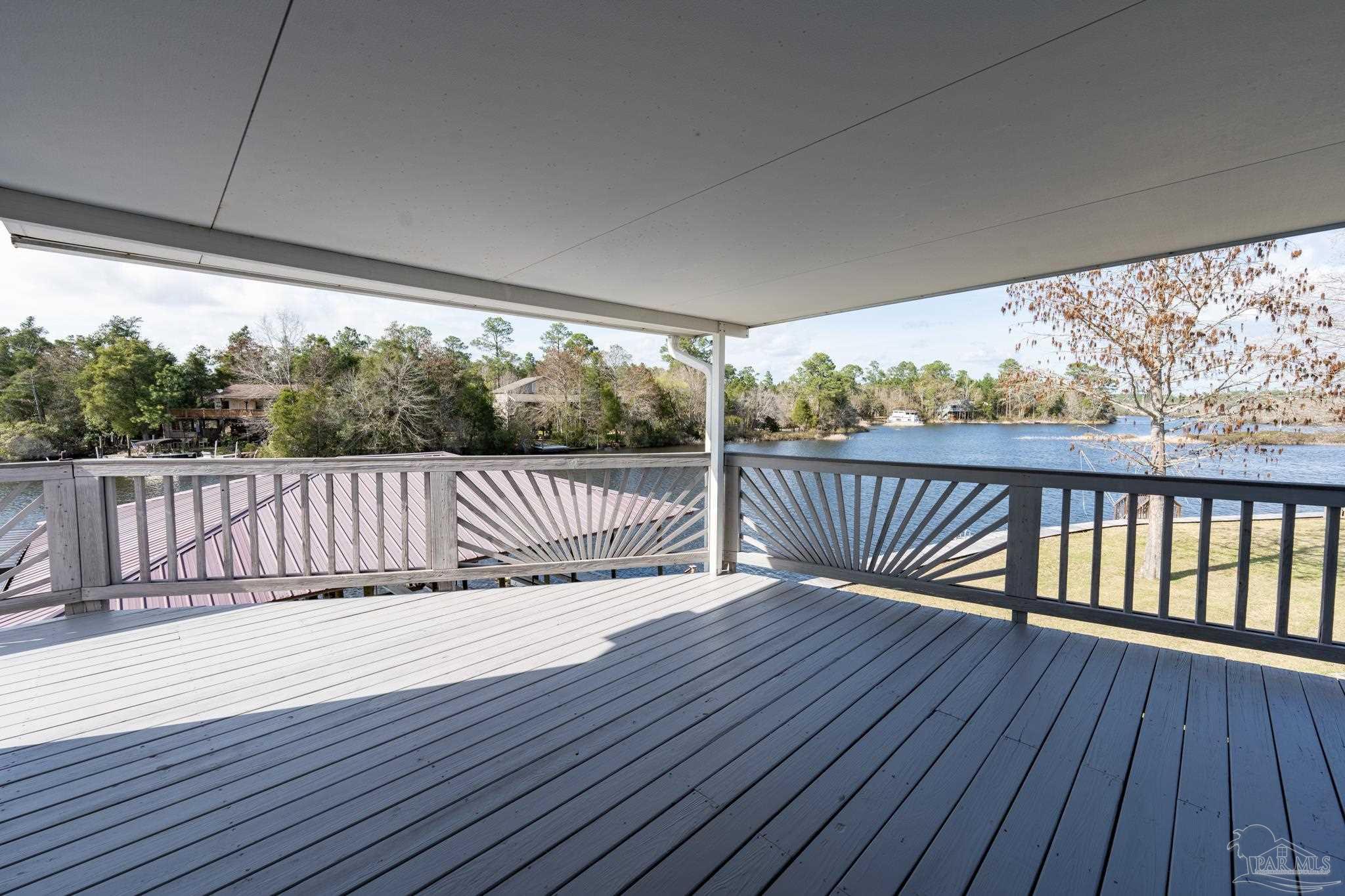7608 River Road Milton, FL 32583 - Photo 19 of 28 a balcony with wooden floor