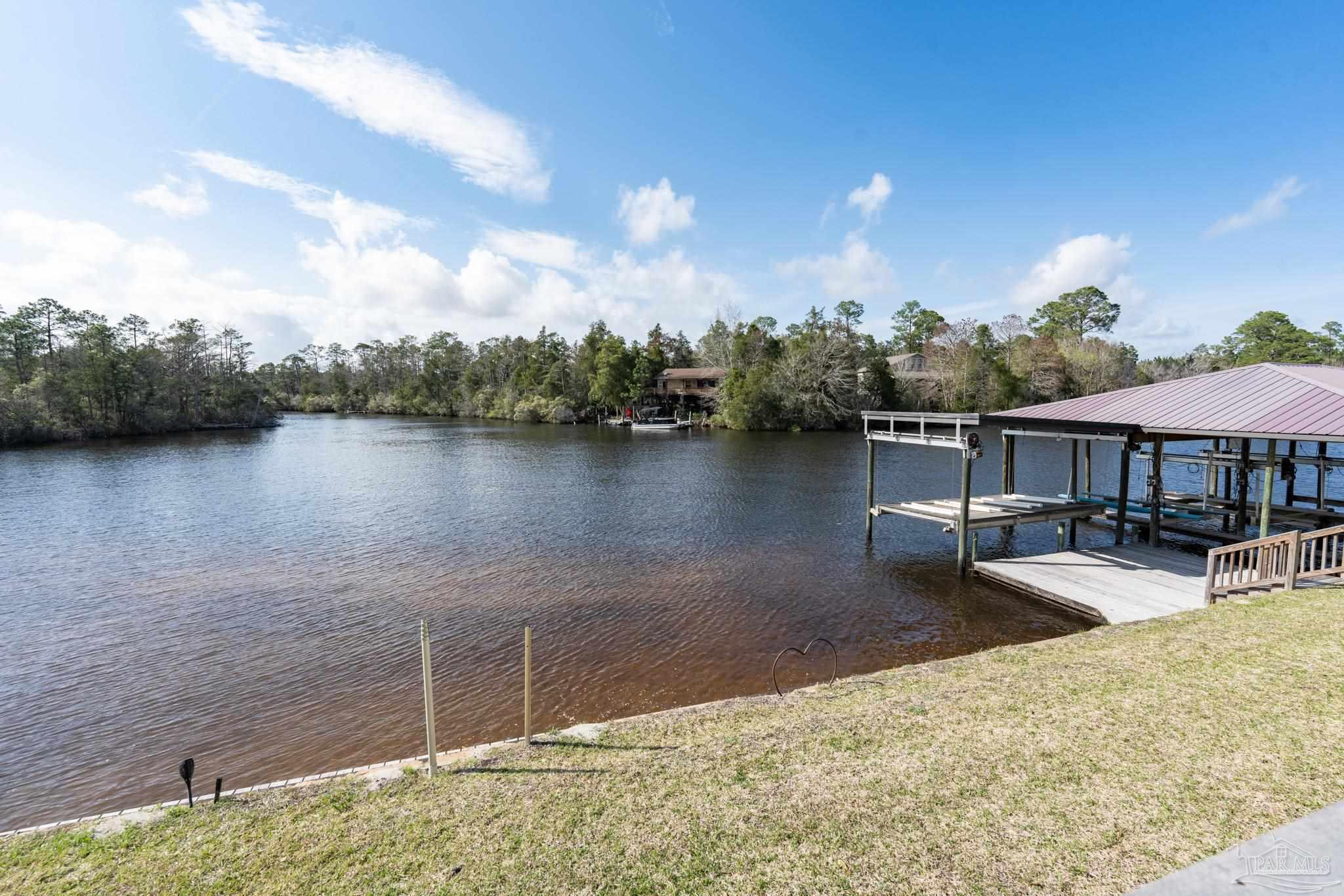 7608 River Road Milton, FL 32583 - Photo 28 of 28 a view of a lake with sitting area