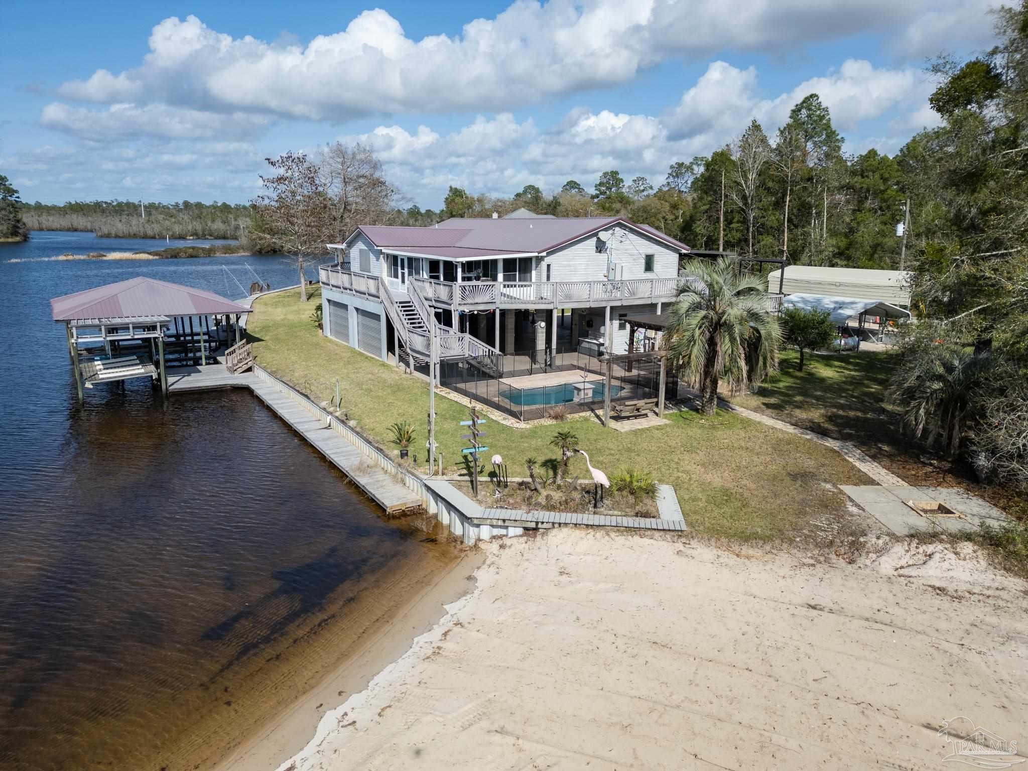 7608 River Road Milton, FL 32583 - Photo 3 of 28 an aerial view of a house with outdoor space ocean view