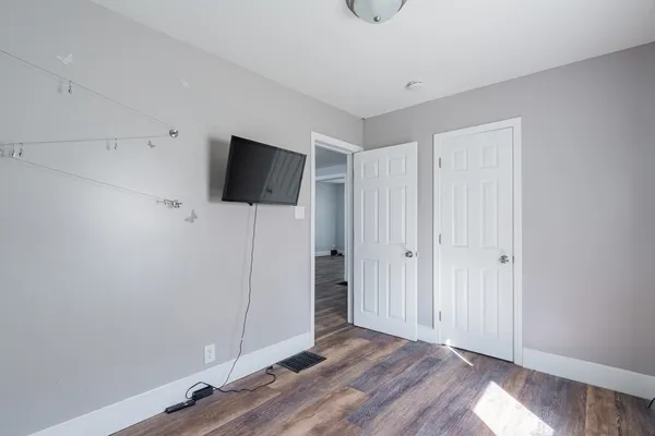 a view of a livingroom with wooden floor