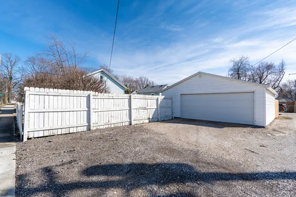 a view of a house with a snow in the yard