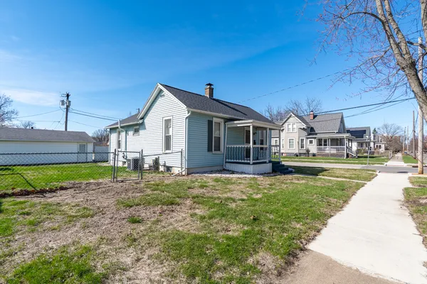 a view of a house with a back yard