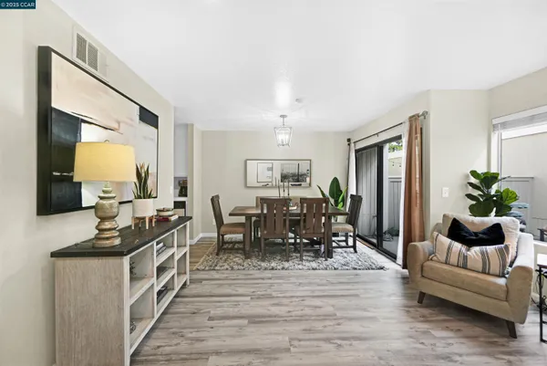 a view of a living room and dining room
