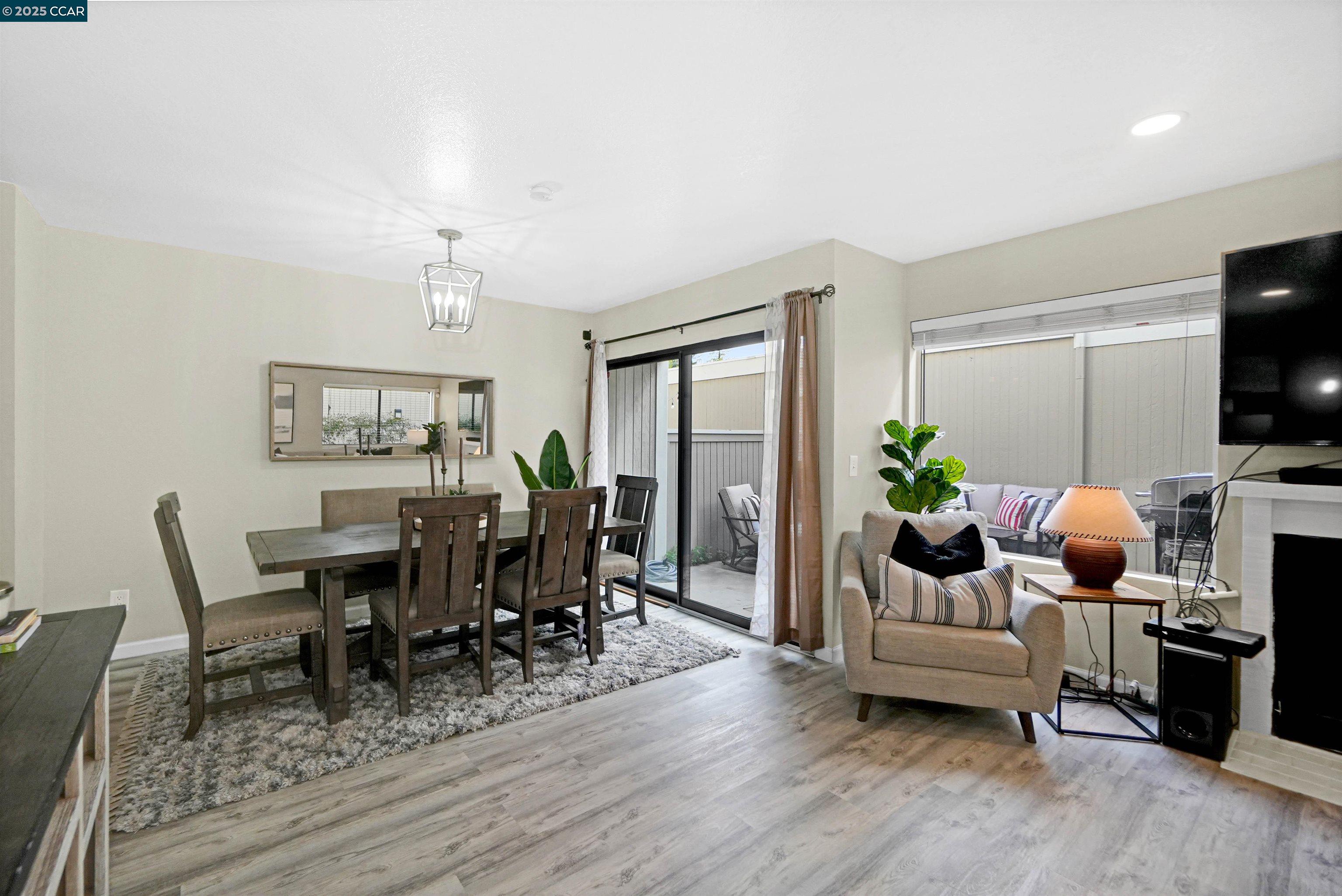303 Atlas Drive, Unit 7 Hercules, CA 94547 - Photo 14 of 52 a living room with furniture and a flat screen tv