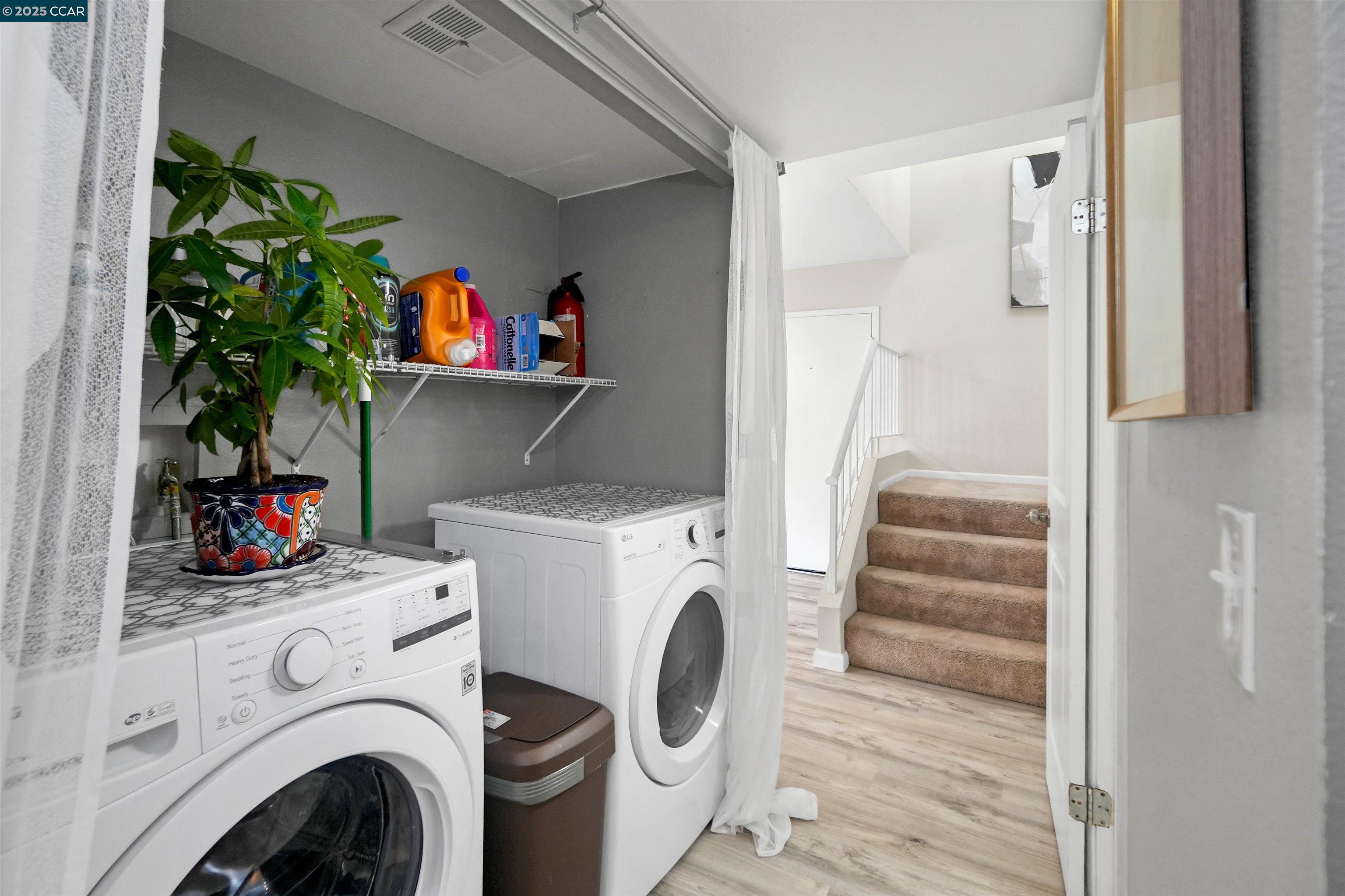 303 Atlas Drive, Unit 7 Hercules, CA 94547 - Photo 21 of 52 a utility room with dryer washer and a view of bedroom