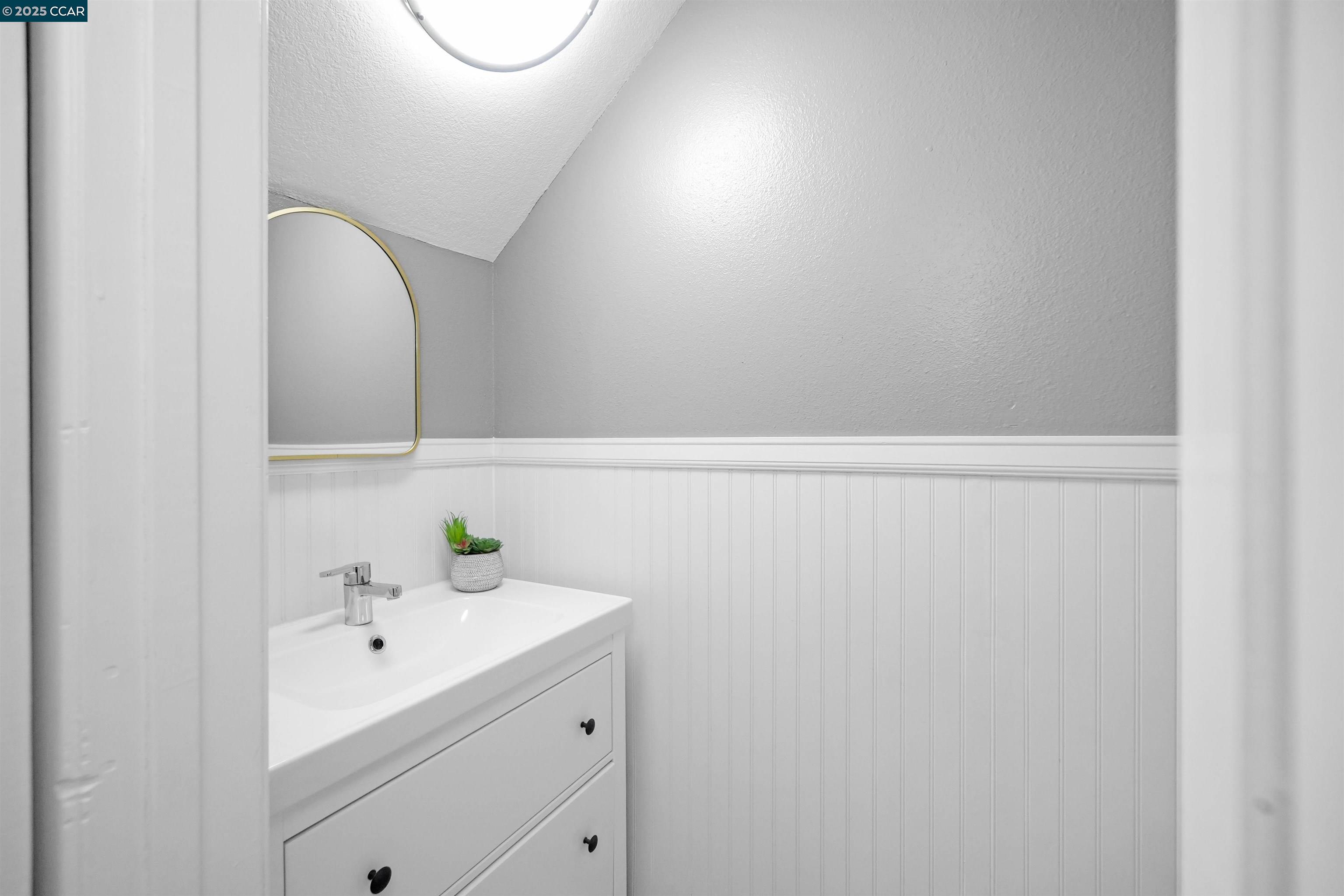 303 Atlas Drive, Unit 7 Hercules, CA 94547 - Photo 23 of 52 a bathroom with a sink and vanity
