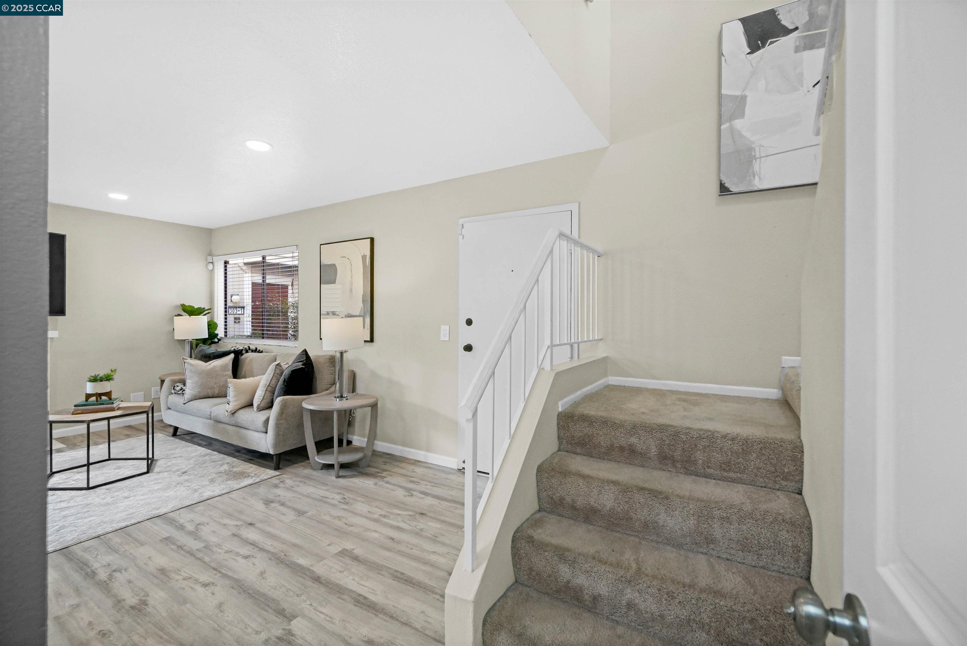 303 Atlas Drive, Unit 7 Hercules, CA 94547 - Photo 24 of 52 a living room with furniture and a wooden floor