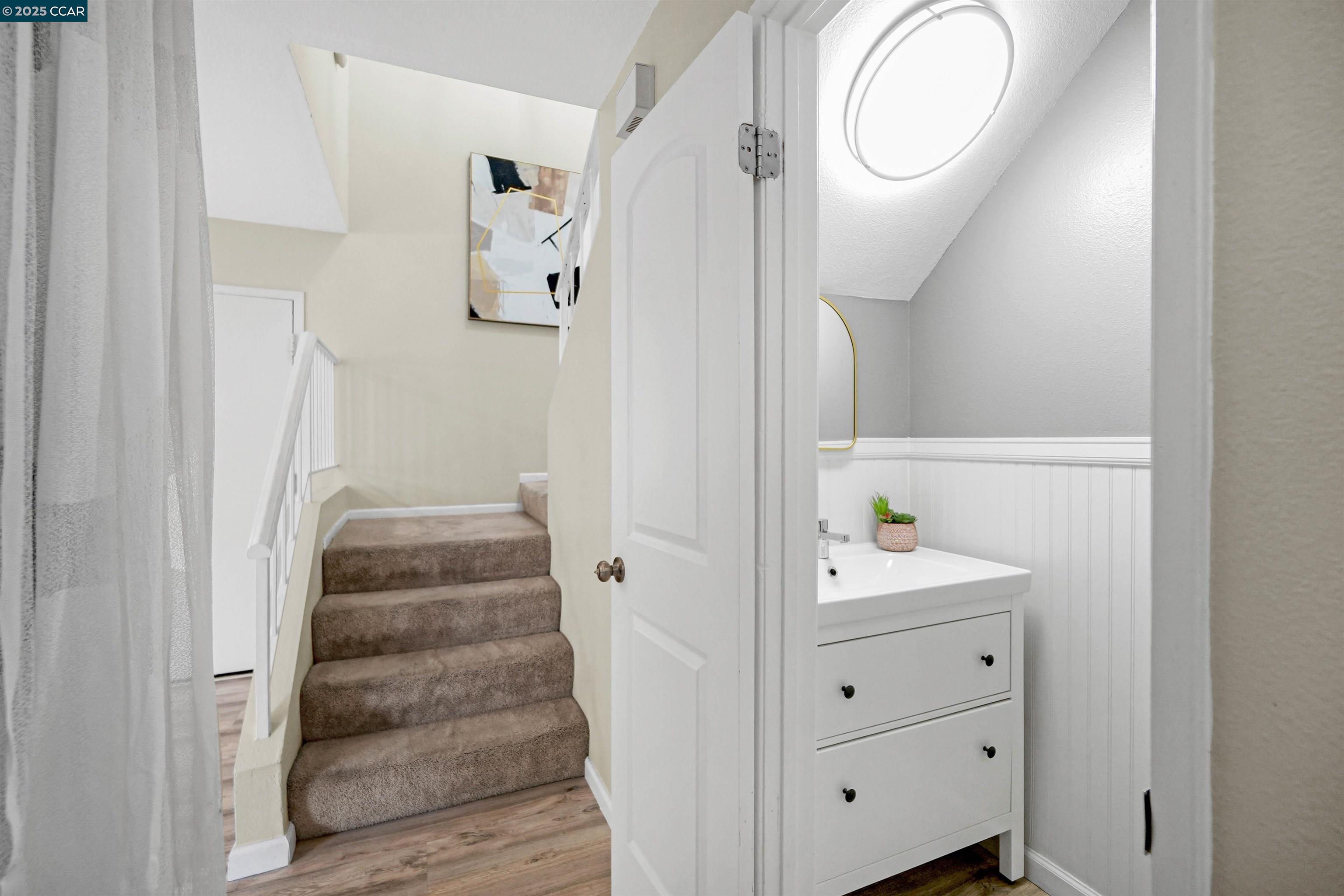303 Atlas Drive, Unit 7 Hercules, CA 94547 - Photo 25 of 52 a bathroom with a sink and a mirror