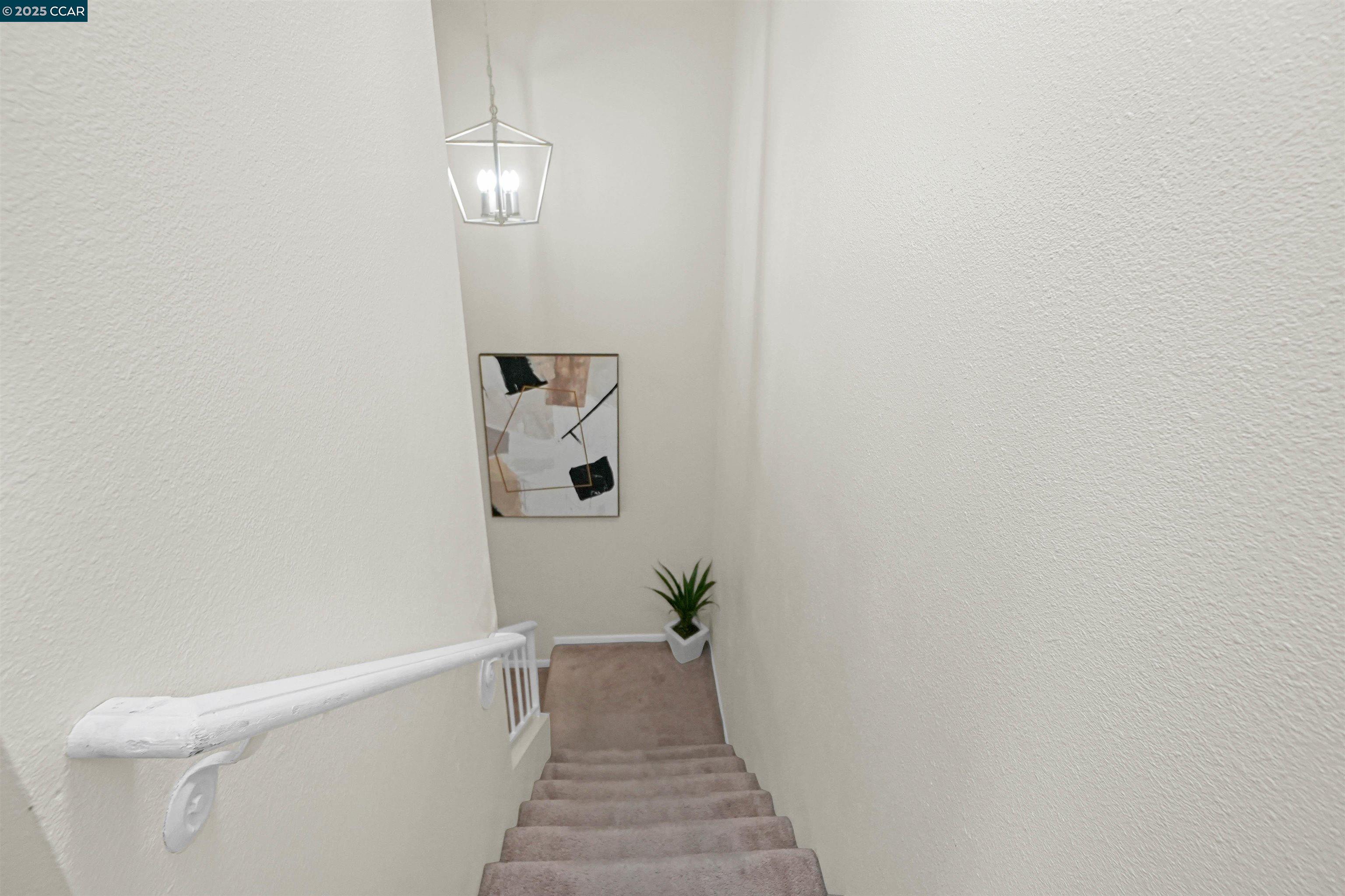 303 Atlas Drive, Unit 7 Hercules, CA 94547 - Photo 27 of 52 a view of a hallway with wooden floor and a bathroom