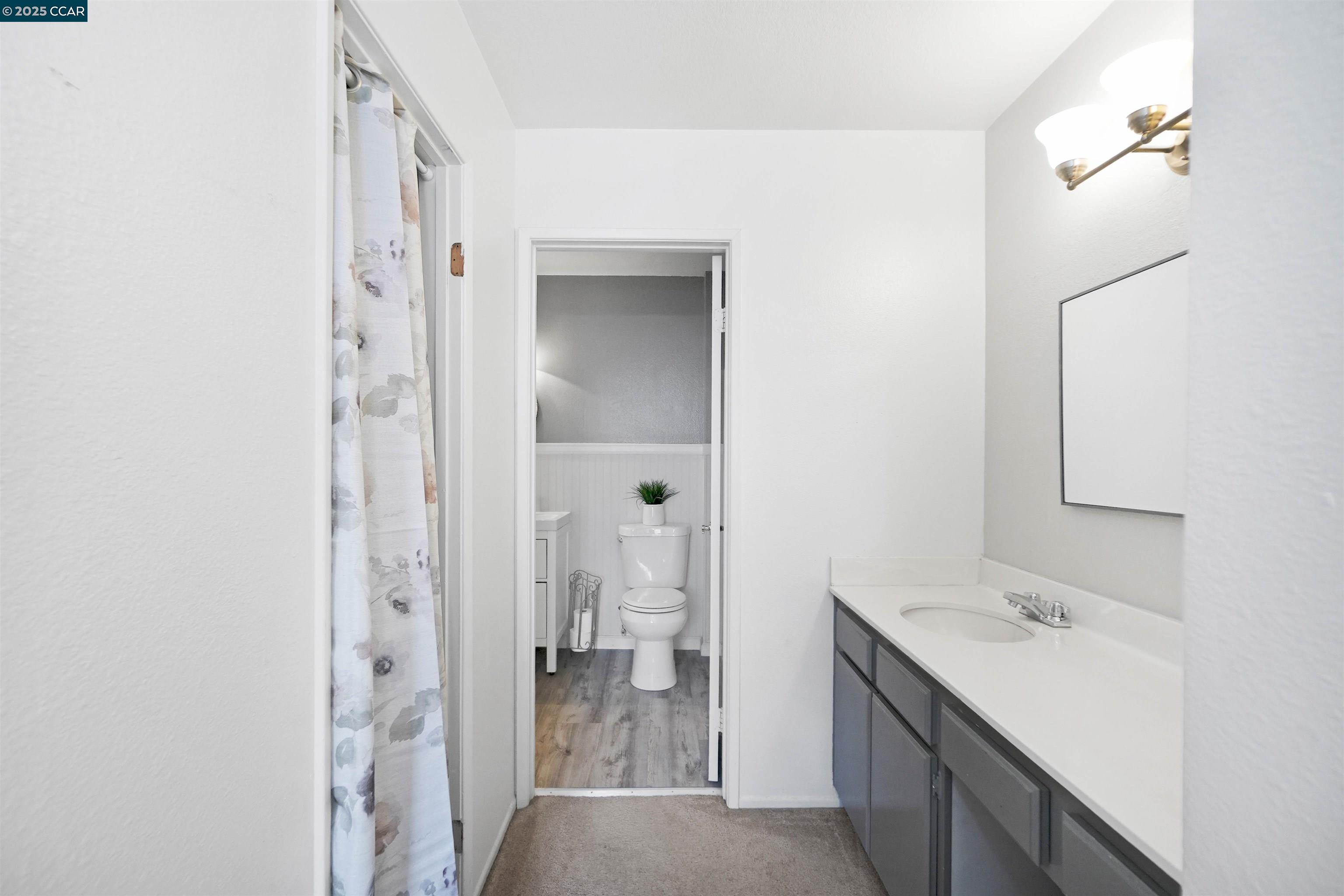 303 Atlas Drive, Unit 7 Hercules, CA 94547 - Photo 31 of 52 a bathroom with a sink and a mirror