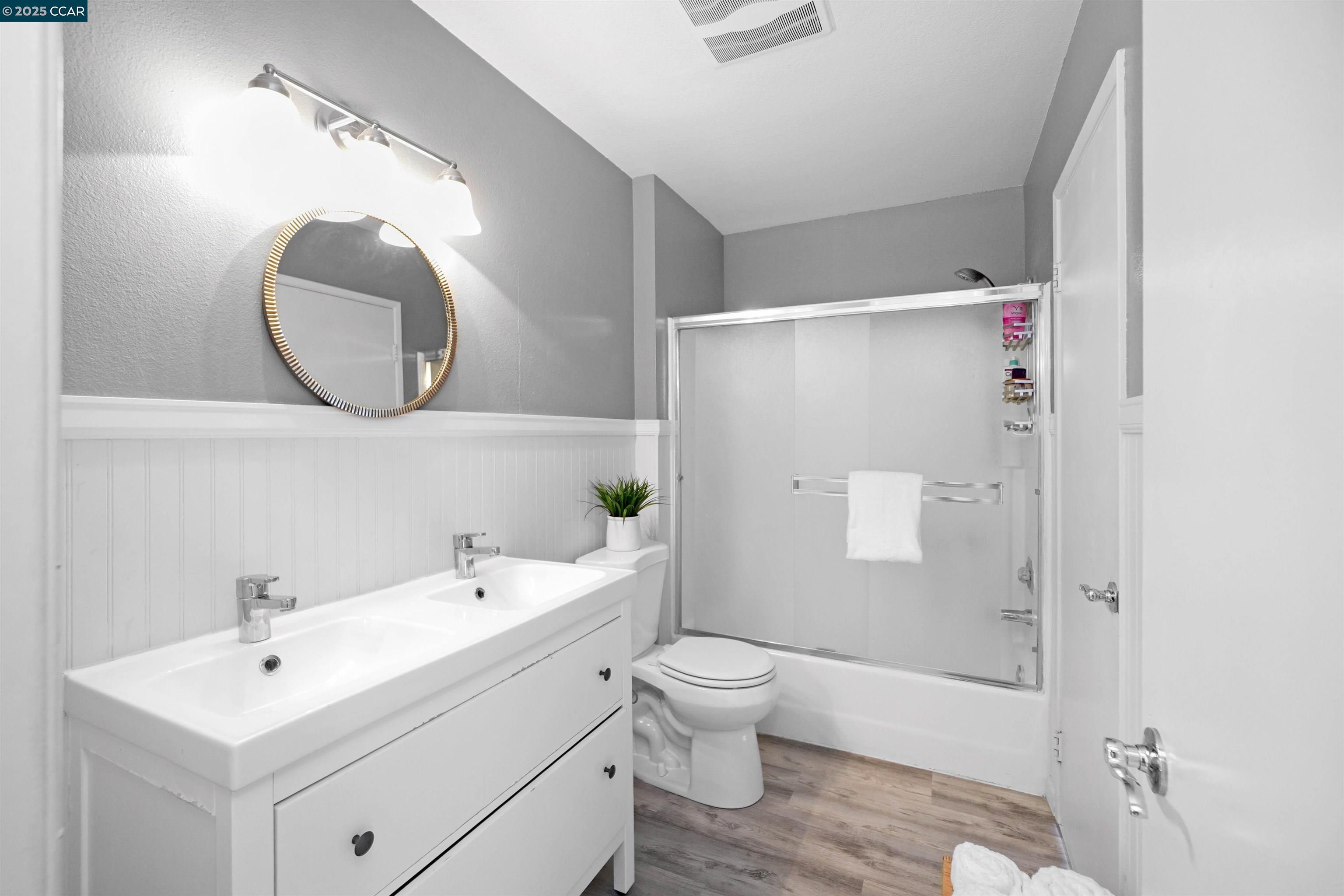 303 Atlas Drive, Unit 7 Hercules, CA 94547 - Photo 33 of 52 a bathroom with a toilet sink and mirror