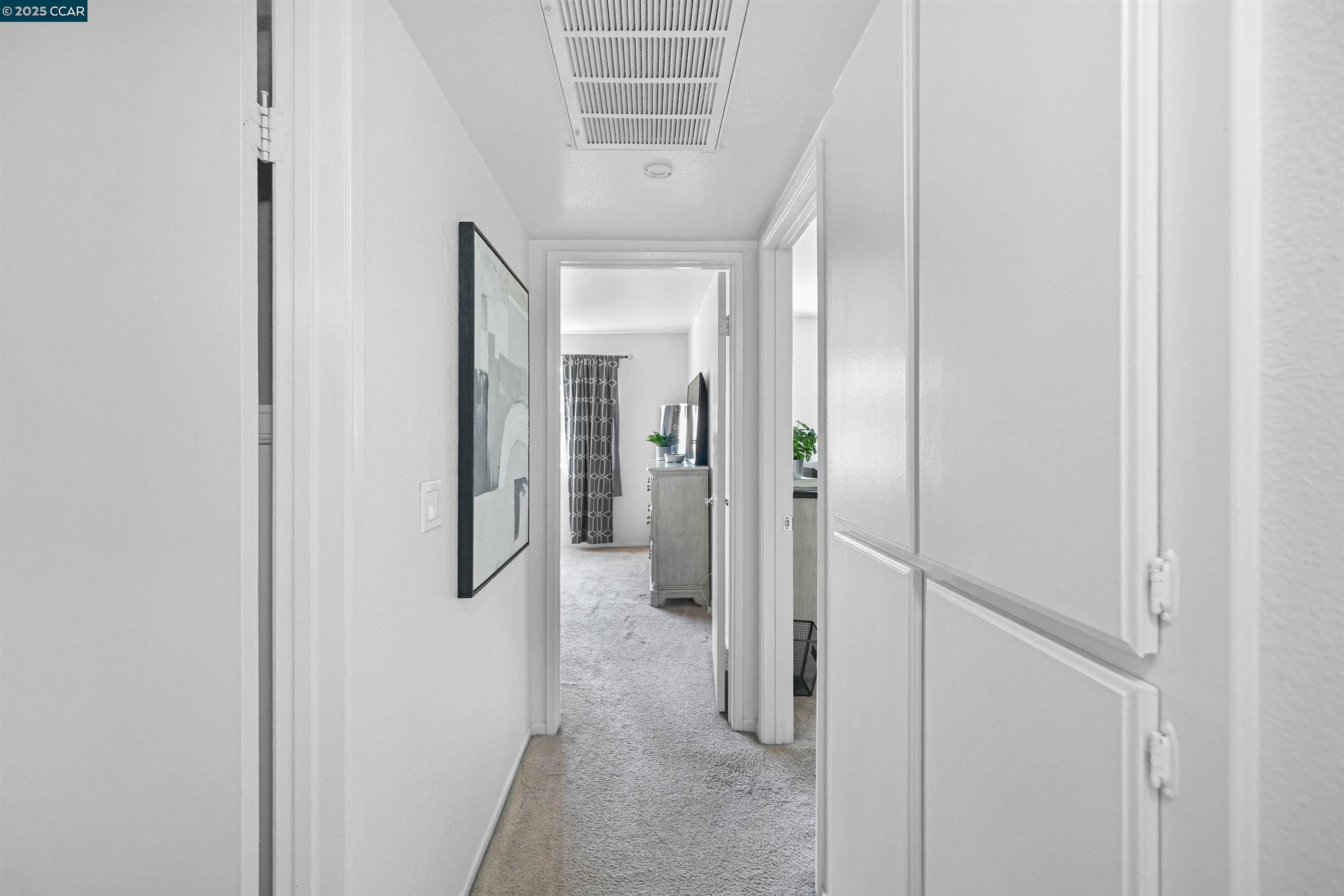 303 Atlas Drive, Unit 7 Hercules, CA 94547 - Photo 37 of 52 a view of a hallway with wooden shelves
