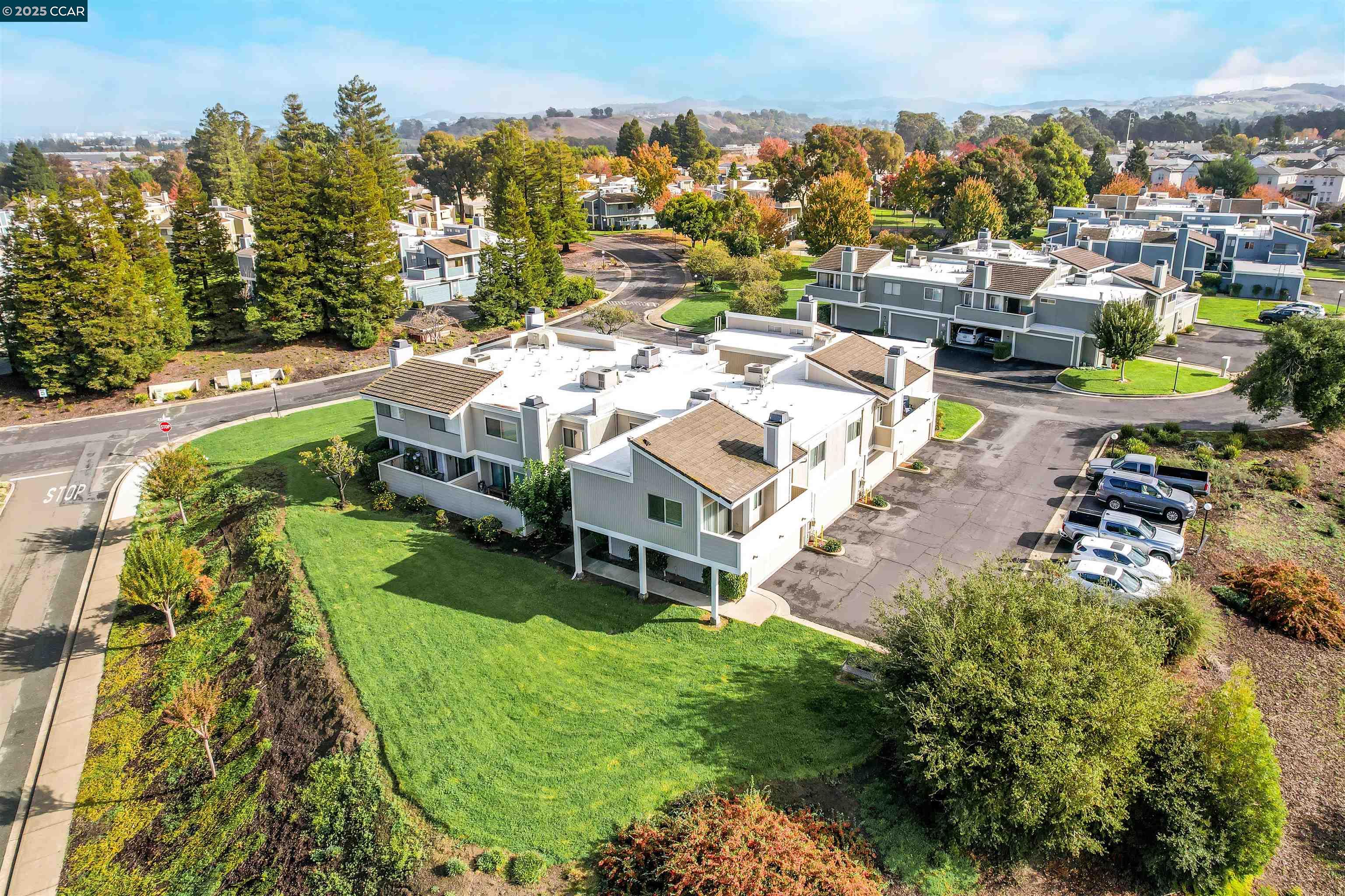 303 Atlas Drive, Unit 7 Hercules, CA 94547 - Photo 45 of 52 an aerial view of a house with a garden and lake view