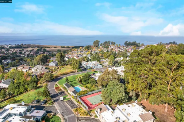 an aerial view of multi story residential apartment building with yard