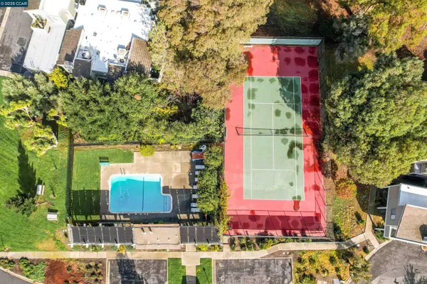 an aerial view of residential houses with outdoor space