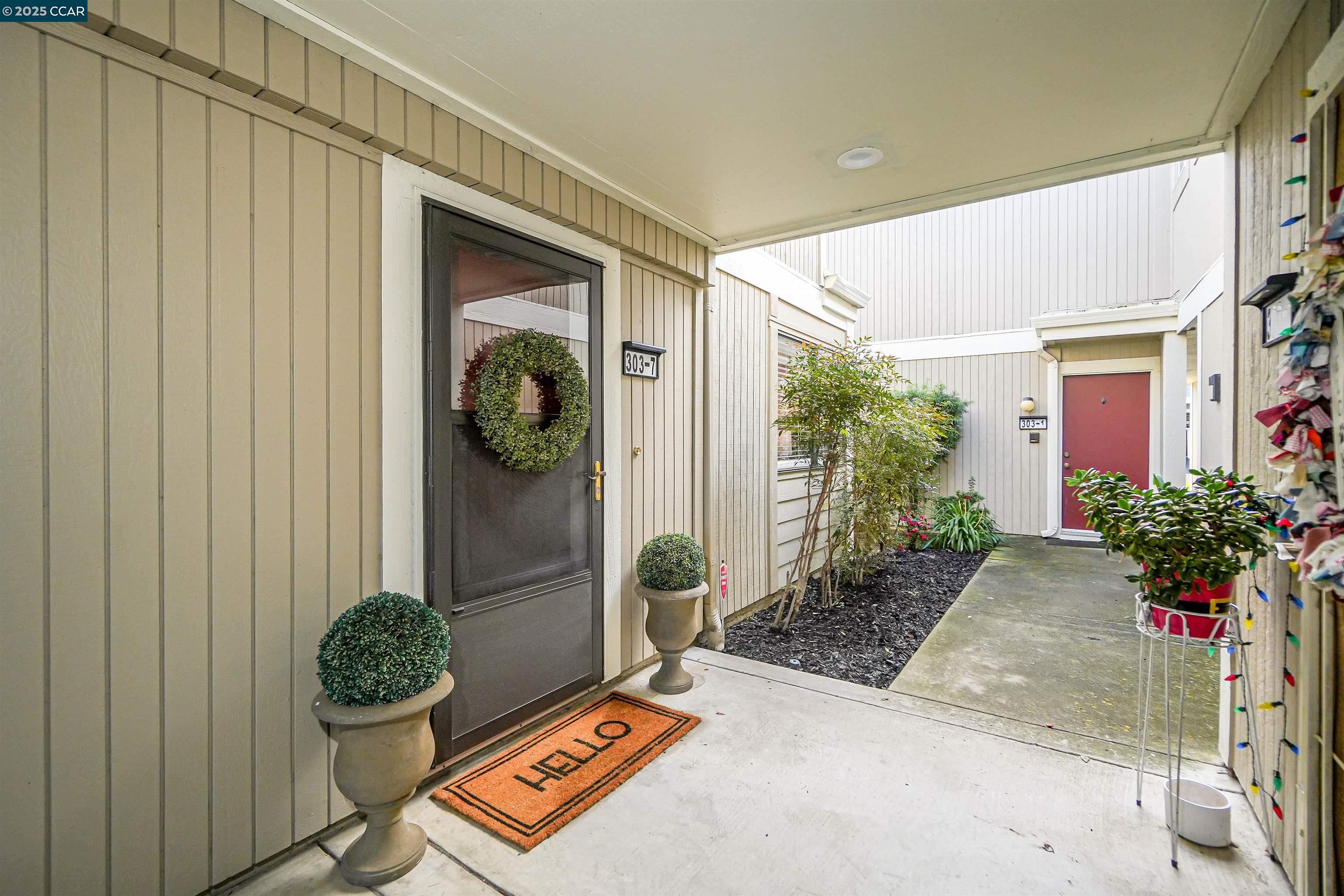 303 Atlas Drive, Unit 7 Hercules, CA 94547 - Photo 6 of 52 a front view of a house with garden