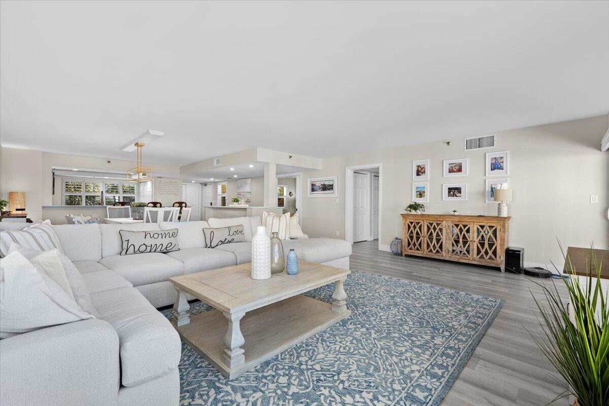 364 Golfview Road, Unit 405 North Palm Beach, FL 33408 - Photo 2 of 33 a living room with furniture and a view of kitchen