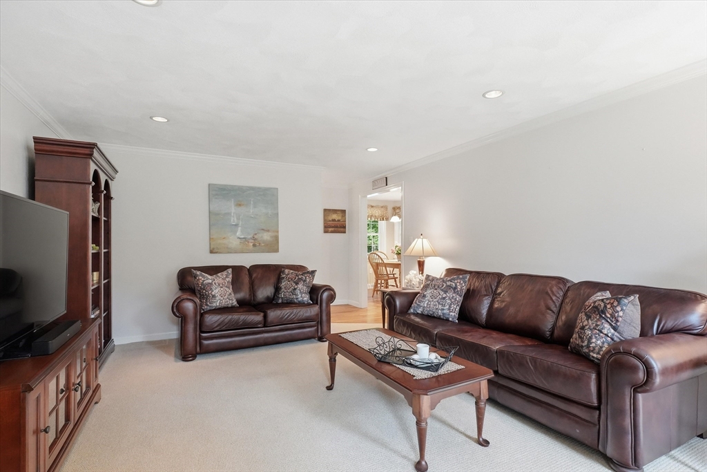 9 Fazio Farm Road Georgetown, MA 01833 - Photo 19 of 42 a living room with furniture a couch and a flat screen tv