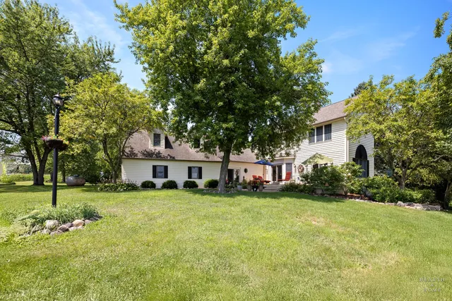 a kitchen with stainless steel appliances granite countertop a refrigerator and wooden cabinets