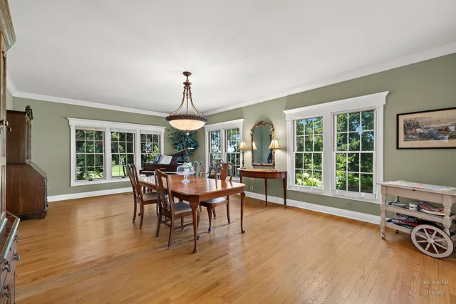 a kitchen with white cabinets and sink