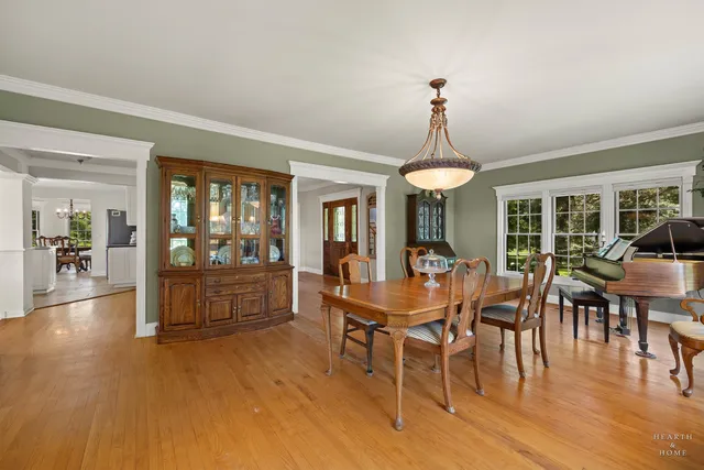 a kitchen with white cabinets and appliances