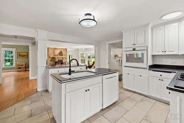 a living room with furniture fireplace and flat screen tv