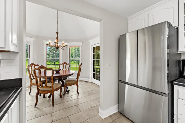 a living room with furniture and large windows