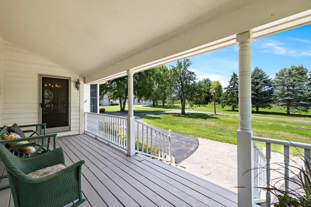 a view of outdoor space with deck and wooden floor