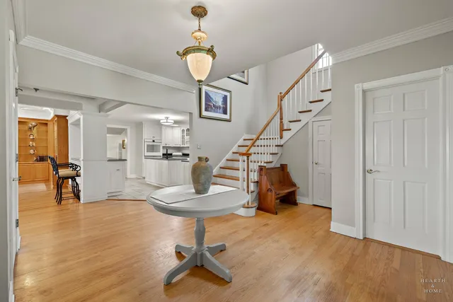 a bed room with a fireplace and flat screen tv
