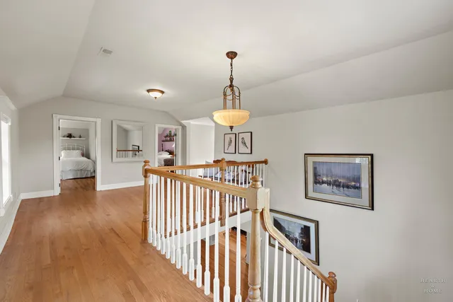 a spacious bathroom with a granite countertop sink toilet and mirror