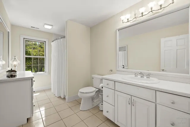 a bedroom with a bed and a desk