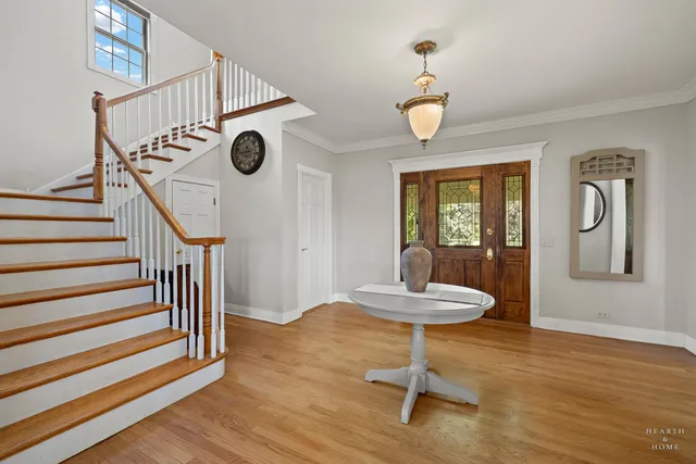 a living room with furniture a dining table and a window