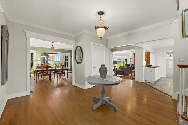 a living room with furniture fireplace and a large window