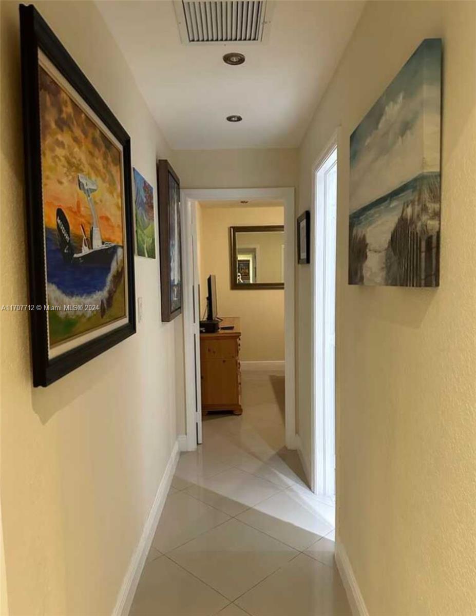 The Hammocks Miami, FL 33196 - Photo 4 of 6 a view of a hallway with a bedroom