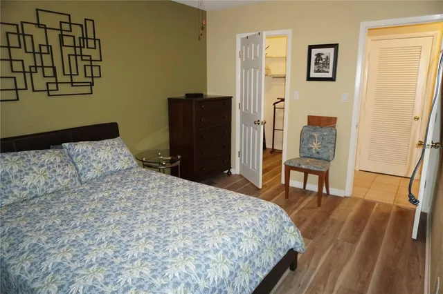 a bedroom with a bed and a table in it