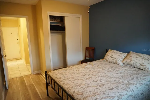 a bedroom with a bed and a dresser